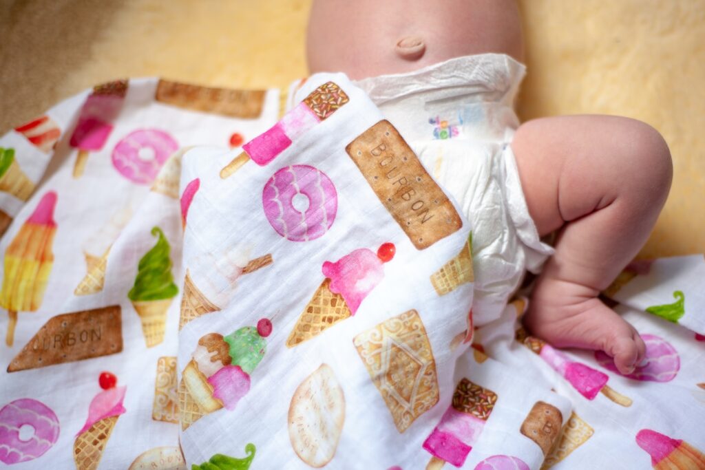 Taken at home of my 3 week old baby as she slept on a new Zealand sheepskin and British biscuit swaddle.