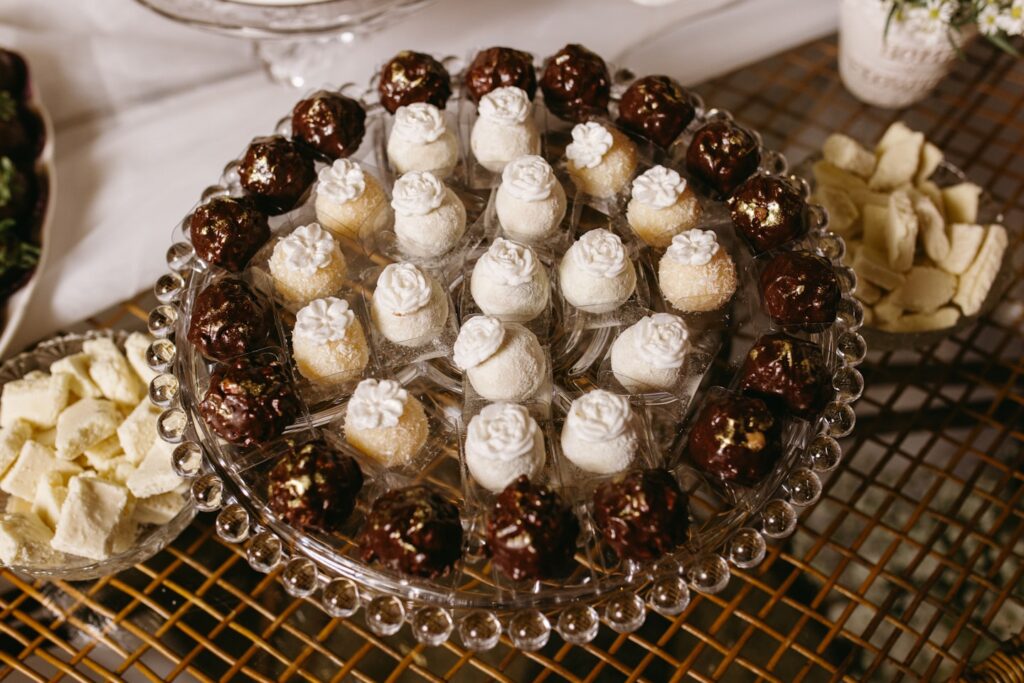 Assortment of chocolate and white dessert balls on a platter